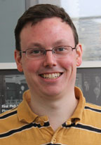 headshot of Greg Ellis