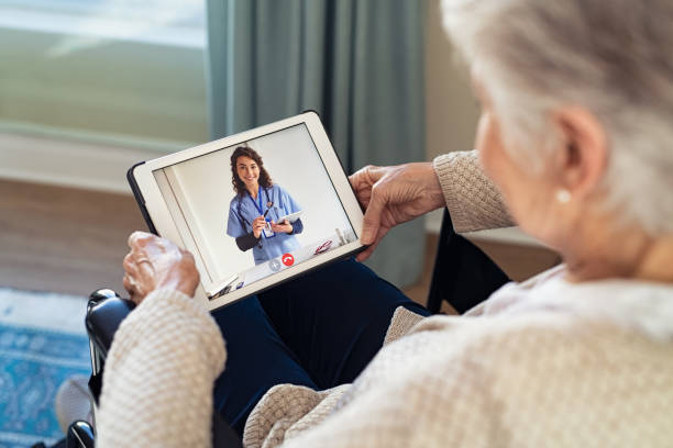 older woman on ipad with doctor