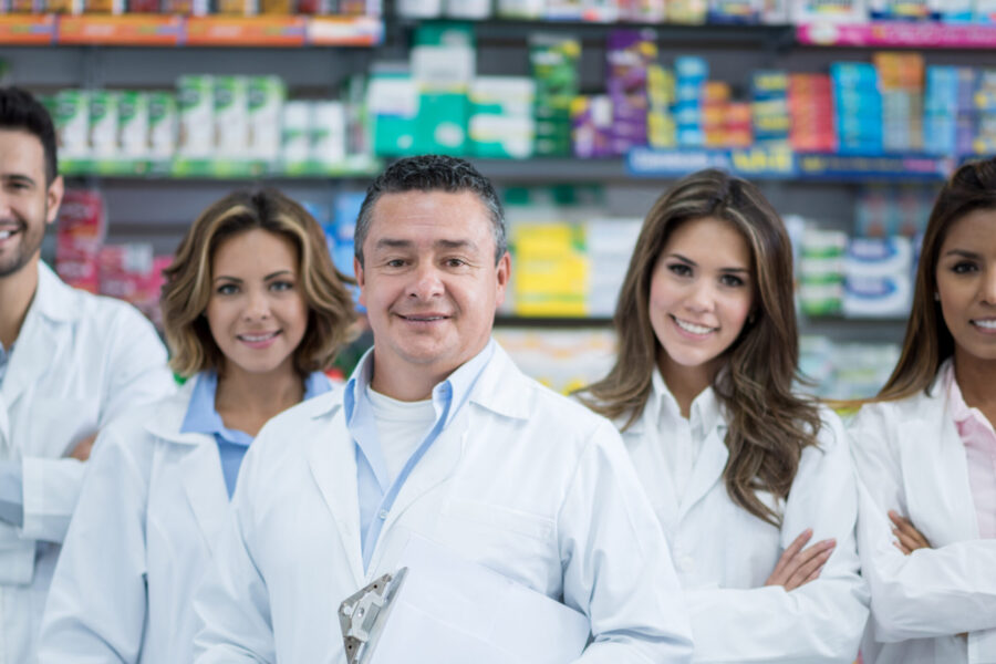 a group of 5 pharmacists in a pharmacy