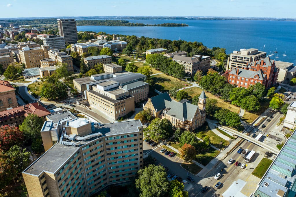 Bird's eye view of central campus, including Chadbourne Hall, Science Hall, Bascom Hill, and Van Hise Hall, with Picnic Point in the distance