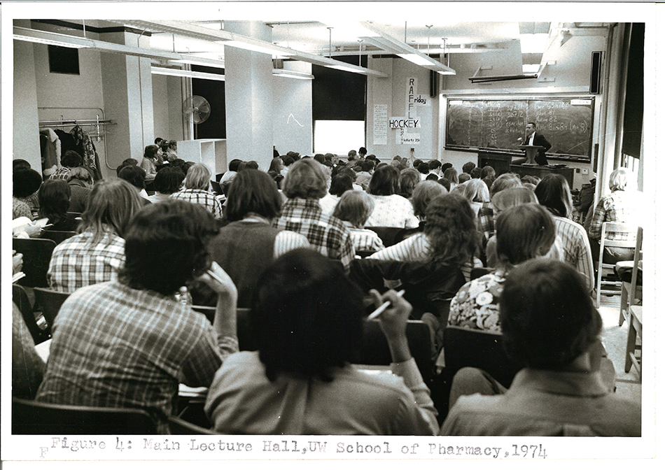 A black-and-white photo of a lecture hall full of students.