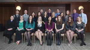 2015 Rho Chi DPH-2 student inductees take time for a group photo at the initiation event held March 1 at Union South, UW-Madison.  Pictured above, front-back, left-right:  Row 1: Rachael Nellessen, Kate Rolling, Rachel Sands, Lindsey Splinter, Irene Chung, Greta Pietraszek, Erika Bauer, Emily Jackson.  Row 2: Eric Chmielewski, Andrew Cannon, Zaifang Huang, Lucy Xiao, Catherine Kuecker, Margaret Shuda, Heejee Jeon, Katherine Zaborowski, Benjamin Heikkinen, Cory Bowers.  Row 3: Jonathin Flury, Casey Paplow, Nathan Menninga.  Not pictured: DPH-2 students: Dustin Fredrickson, Briana Frolov, Hailey Keeser, Sarah Maerzke, Daniel Rosin.  Faculty advisors: Mary Hayney, professor (CHS), Pharmacy Practice Division, Warren Rose, associate professor (CHS), Pharmacy Practice Division.