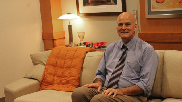 Paul Hutson sitting down in the clinical therapy room