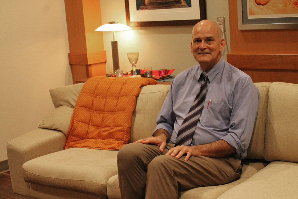 Paul Hutson sitting down in the clinical therapy room