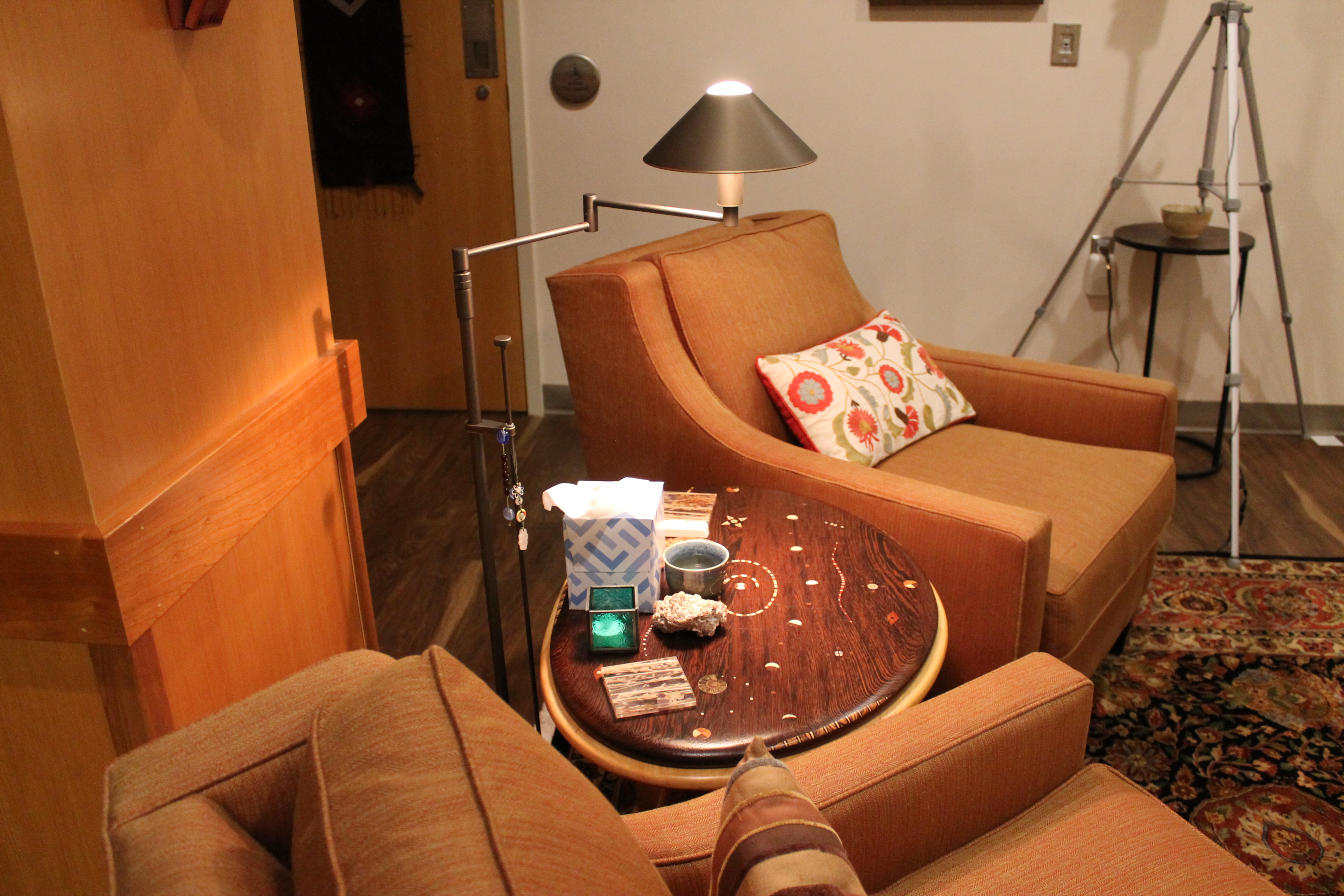 Two chairs surround an endtable in the Clinical Research Facility.