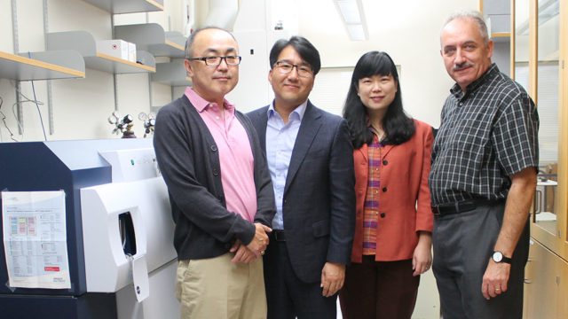 Glen Kwon, Seungpyo Hong, Lingjun Li, and Sandro Mecozzi standing in a lab