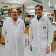 two Z-Station scientists stand in the lab