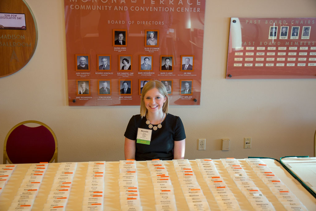 Meredith Frey behind name tag table