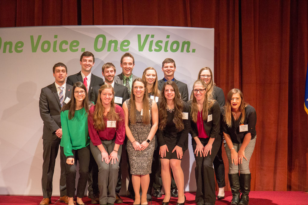 School of pharmacy student group taking a picture onstage