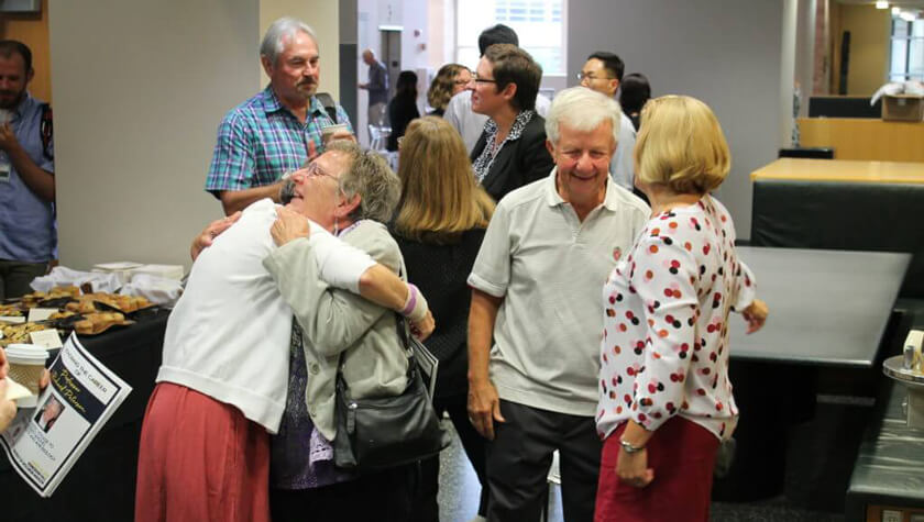 Dick Peterson greets friends