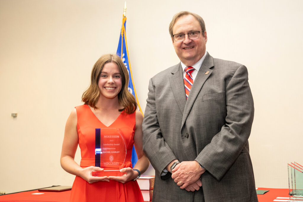 Rachel Hawley poses with Dean Steve Swanson and the McKesson Leadership Award.
