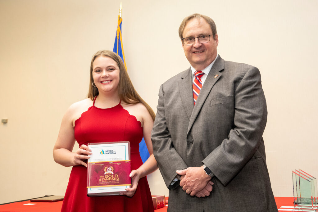 An award-winner poses with Dean Steve Swanson.
