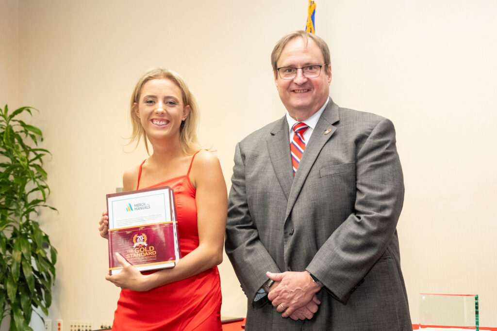 An award-winner poses with Dean Steve Swanson.