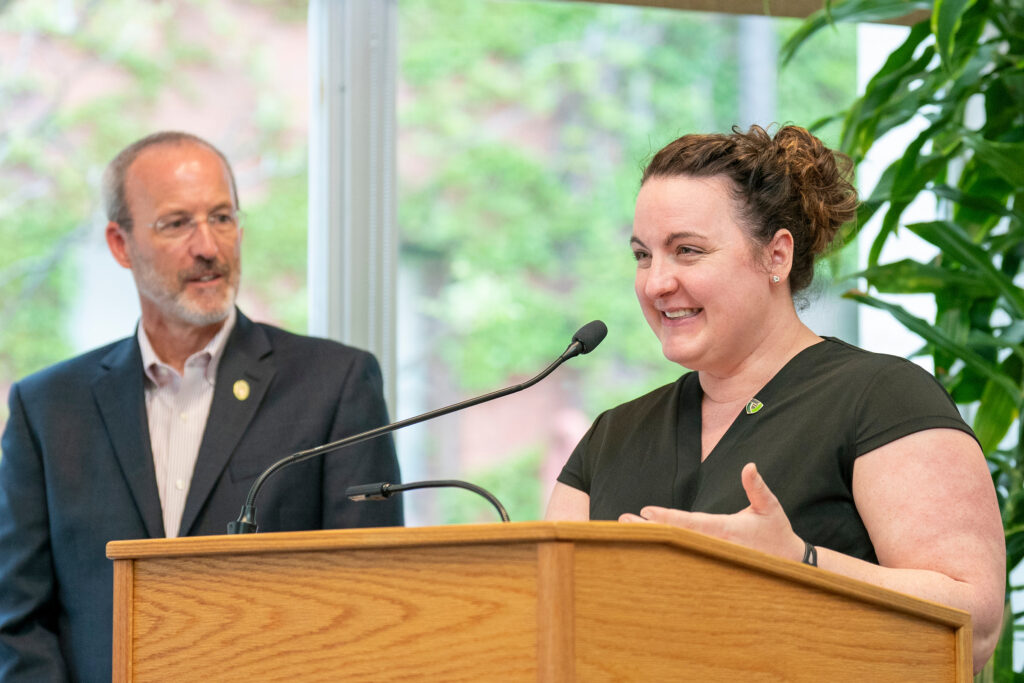 An award presenter representing PSW speaks at the podium.