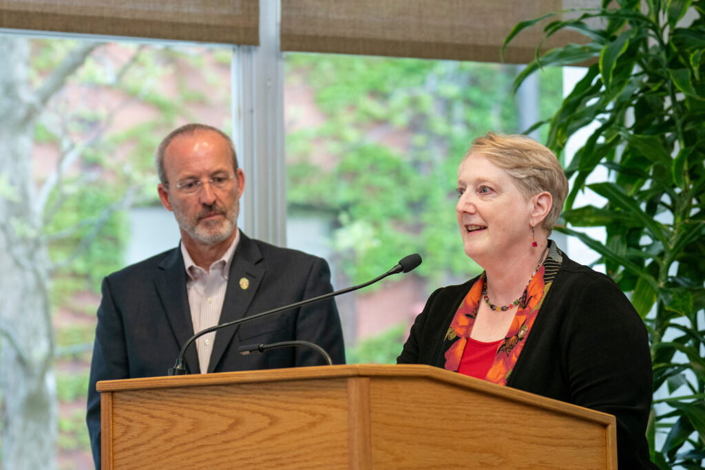 Karen Kopacek speaks at the podium.