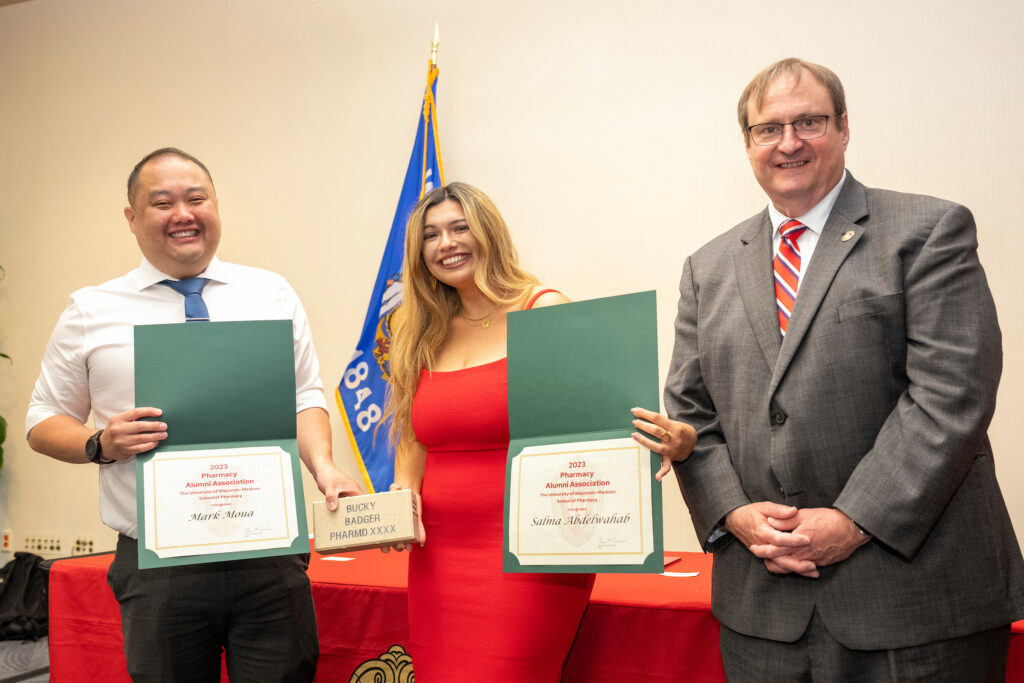 Mark Moua and Salma Abdelwahab pose with their PAA awards and Steve Swanson.