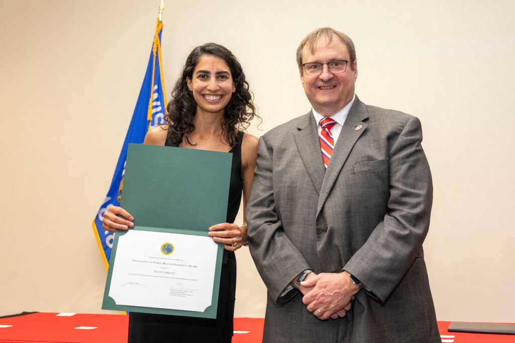 Dean Steve Swanson poses with an award winner.