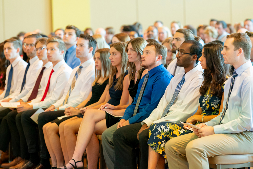 Students sitting in their seats looking at the podium