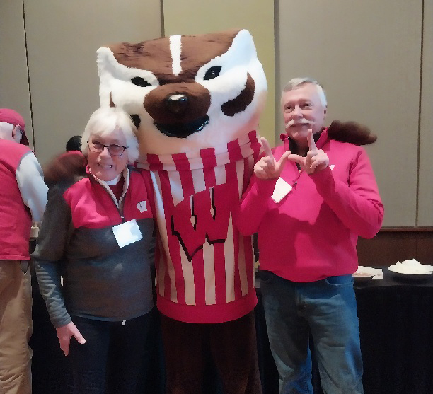 Tom and Sandy Blumenberg pose with Bucky Badger