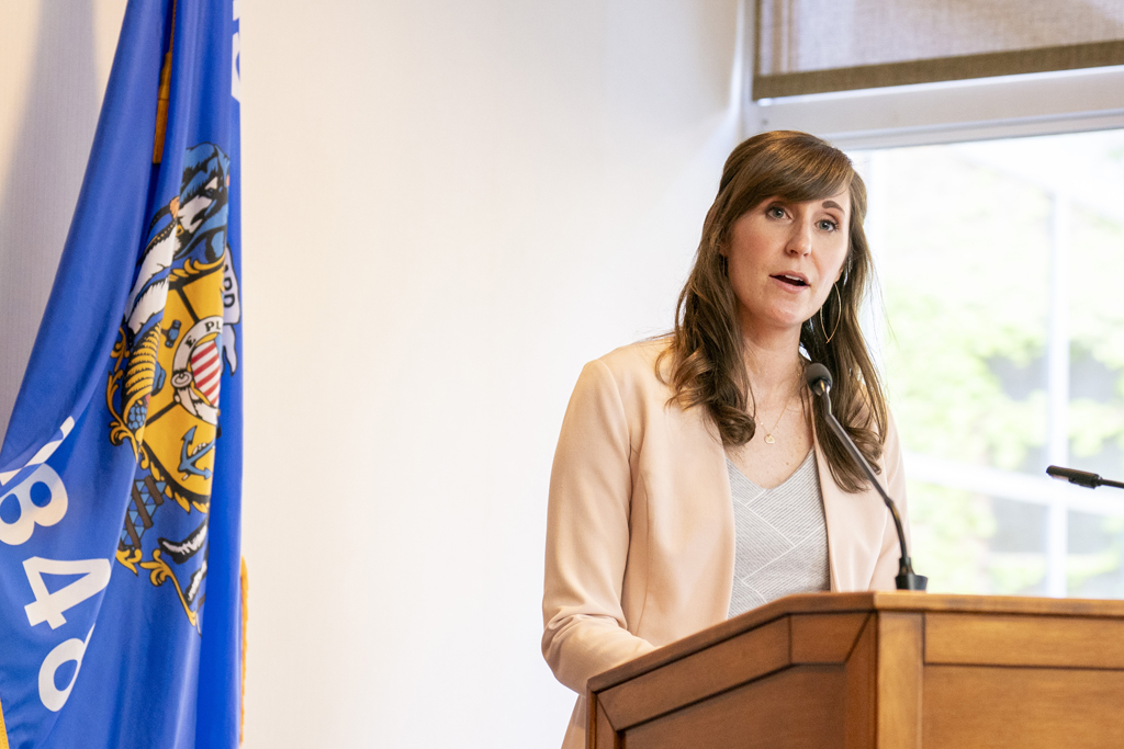 Kate Hartkopf speaks at the podium