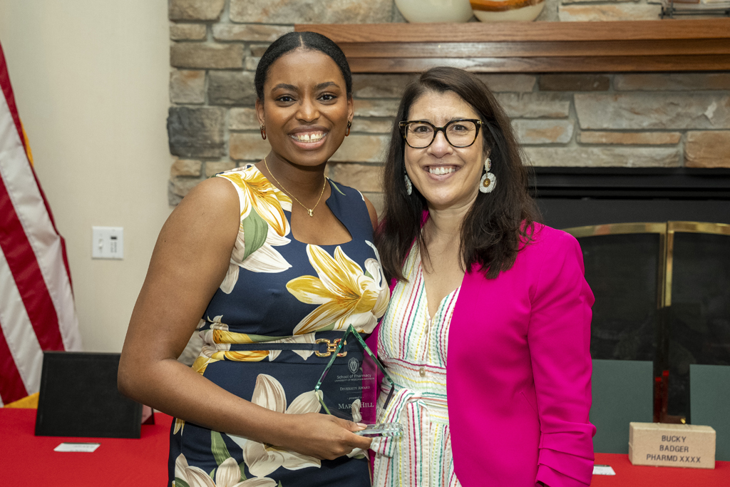 Maria Hill receives an award from Lisa Imhoff