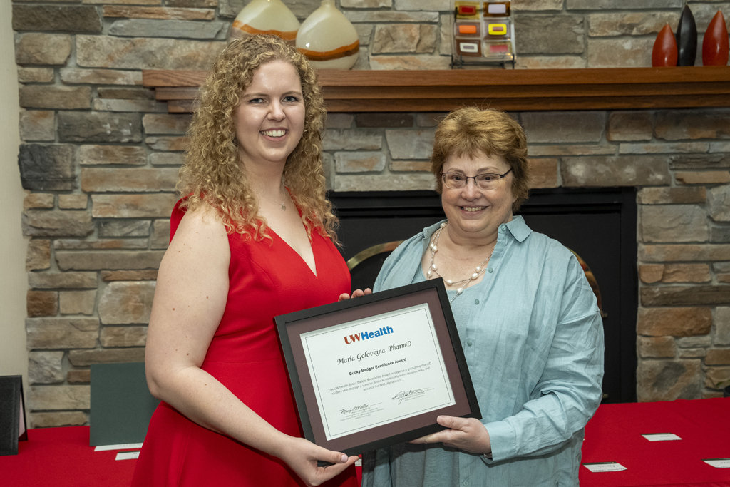 Mary Mably presents an award to Maria Golovinka
