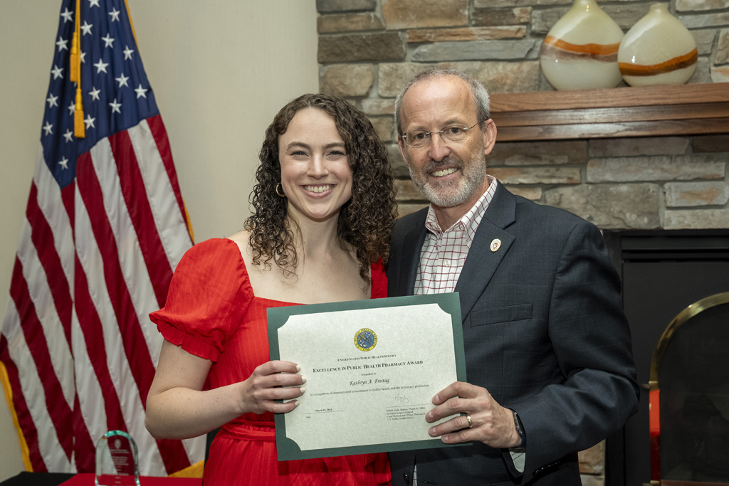 Dave Mott presents an award to Katie Frietag