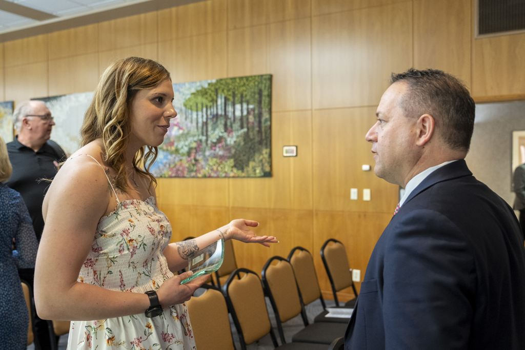 Brent Eberle speaks with a graduate