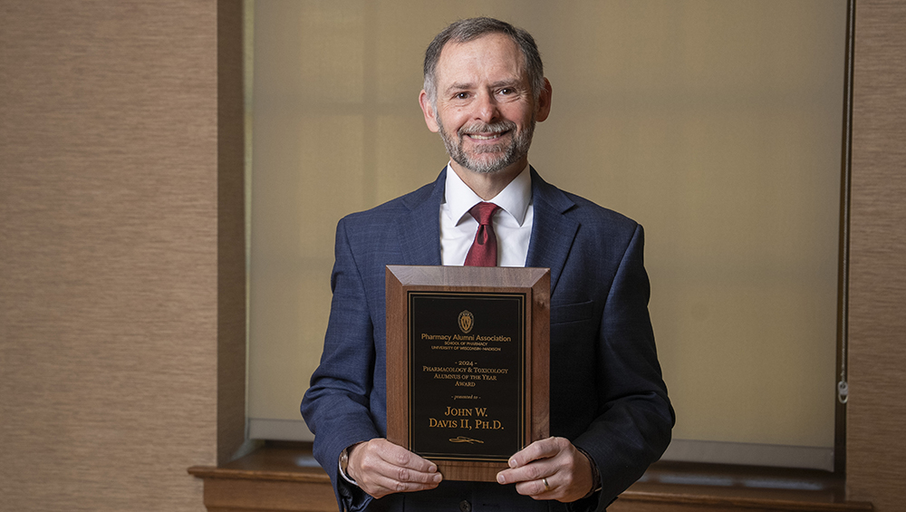 John Davis with his PharmTox Alum of the Year award.
