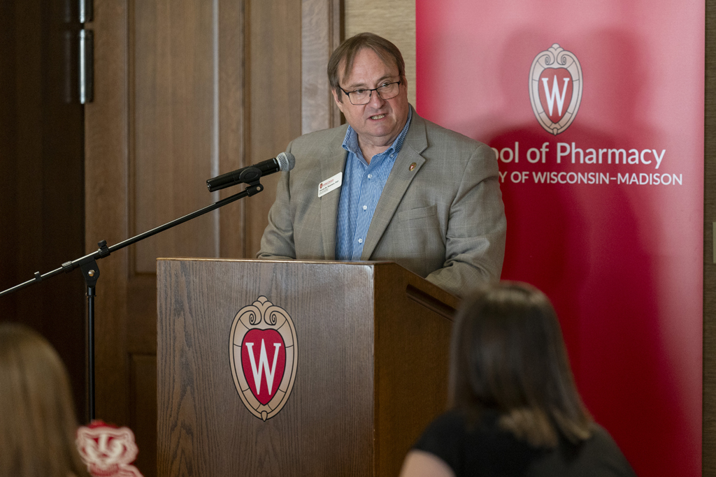 Dean Steve Swanson speaks at the podium