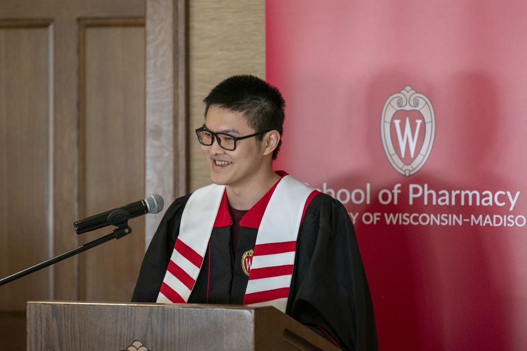 Ethan Cui speaks at the podium