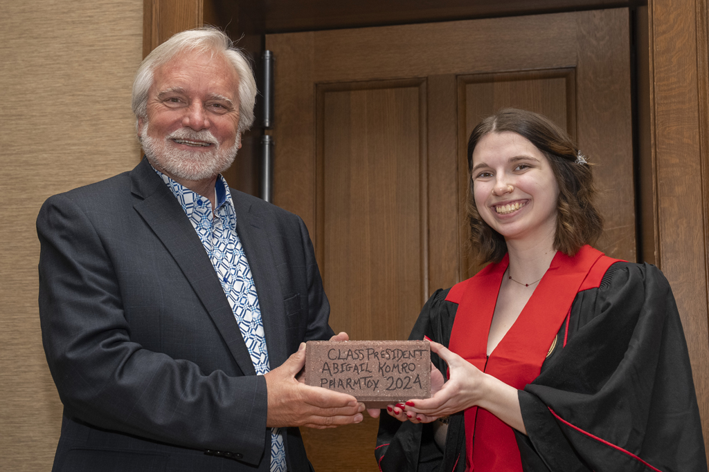Abigail Komro receives a Legacy Brick for serving as class president