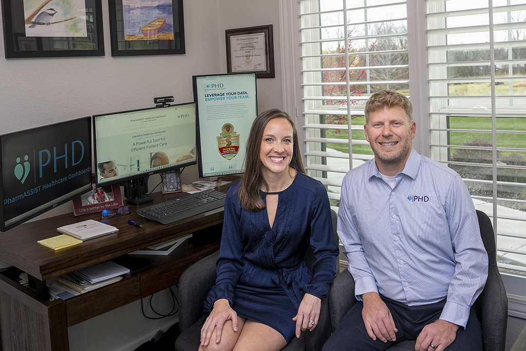 Jesse and Jessica Schaetzel pose in their home office