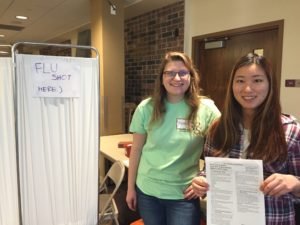 Marnie Janson and Jin Seo at flu shot station