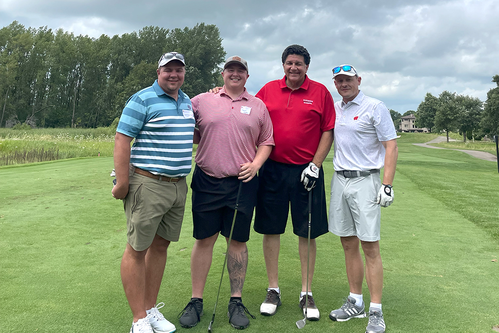 Tyler Prickette, Sean Baltes, Rocky LaDien, and Jason Lau pose for a photo