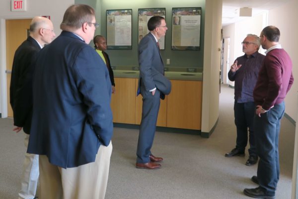 Provost Karl Scholz listening to Jeff Johnson speaking with numerous SoP staff gathered also listening