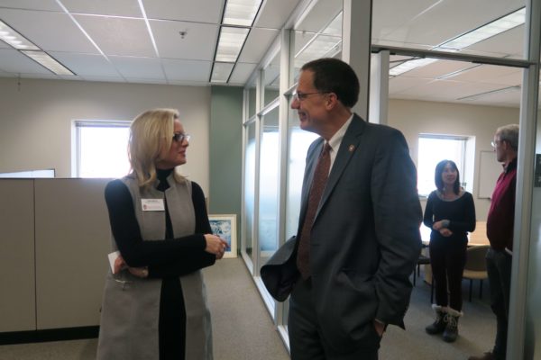 Provost Karl Scholz speaking with Professor Beth Martin