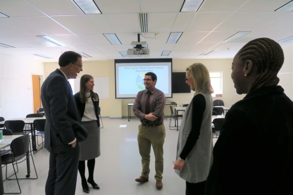 Provost Karl Scholz talking in a group with SoP staff