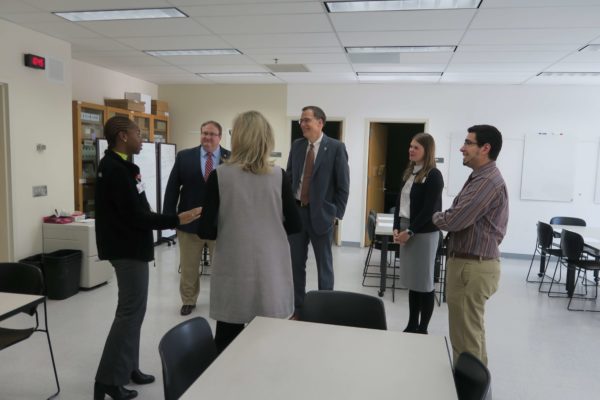 Provost Karl Scholz talking in a group with SoP staff