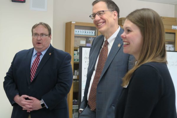 Side shot of Steve Swanson, Provost Karl Scholz, and Andrea Porter smiling
