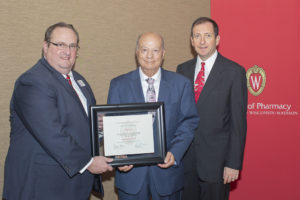 School of Pharmacy Dean Steve Swanson, Citation of Merit winner Ibrahim Jalal (PhD '78), and Eric Buxton, associate professor and chair of the awards committee