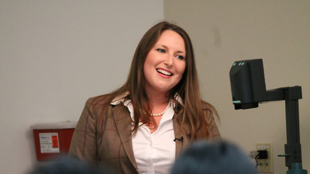 Katherine Fallace speaking at podium
