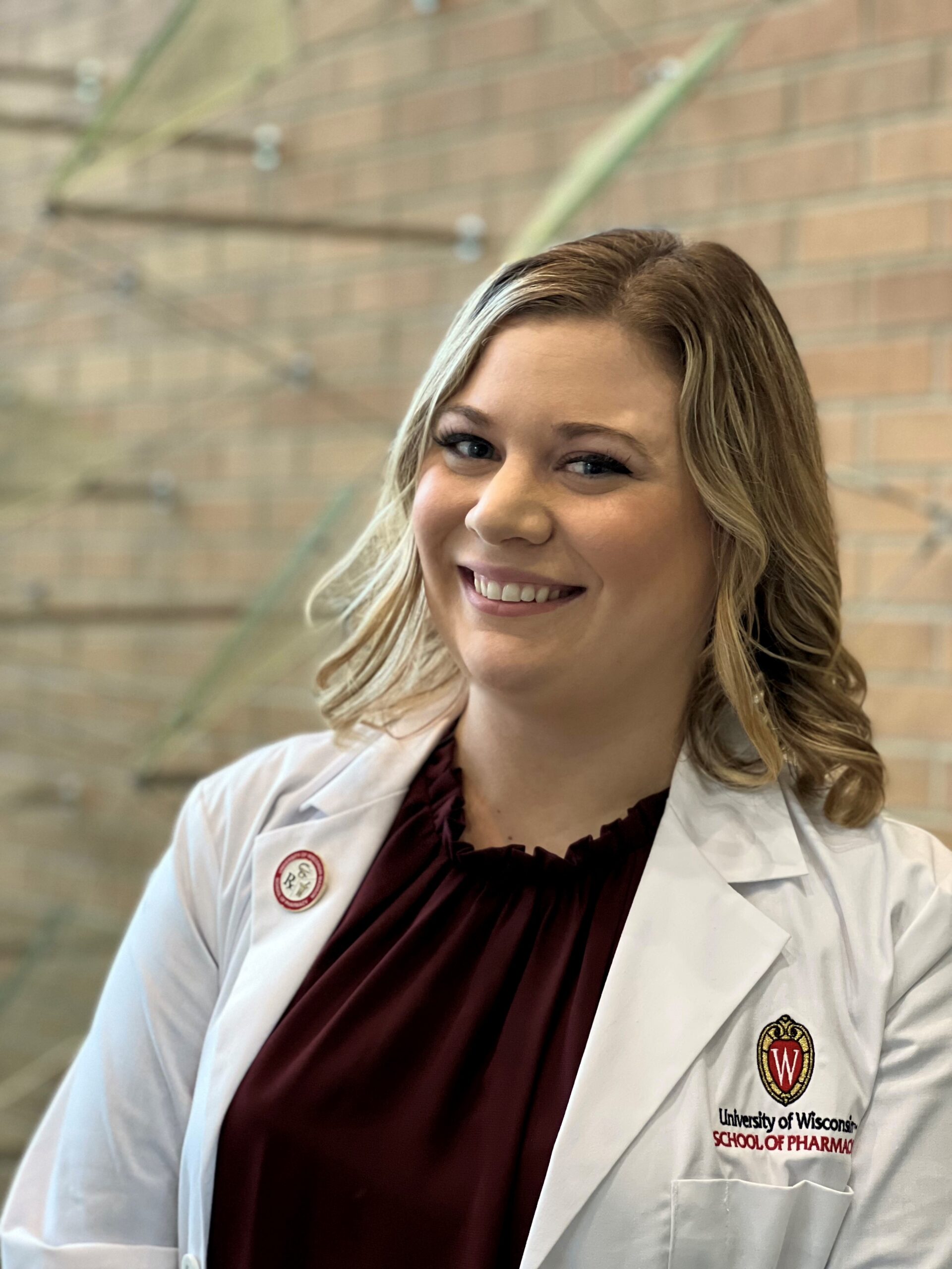 Kendra Isberner poses in her white coat