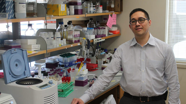 Jason Kwan at his lab counter