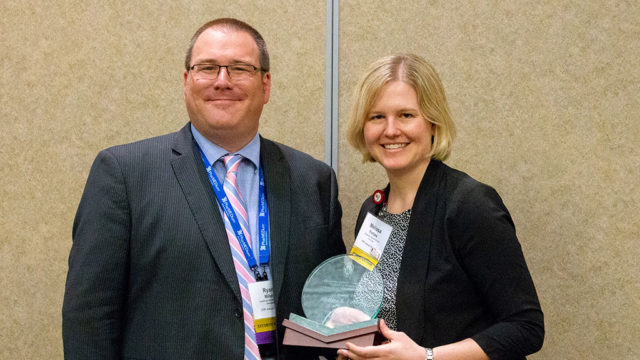 Ryan Miller and Melissa Forbes with her award