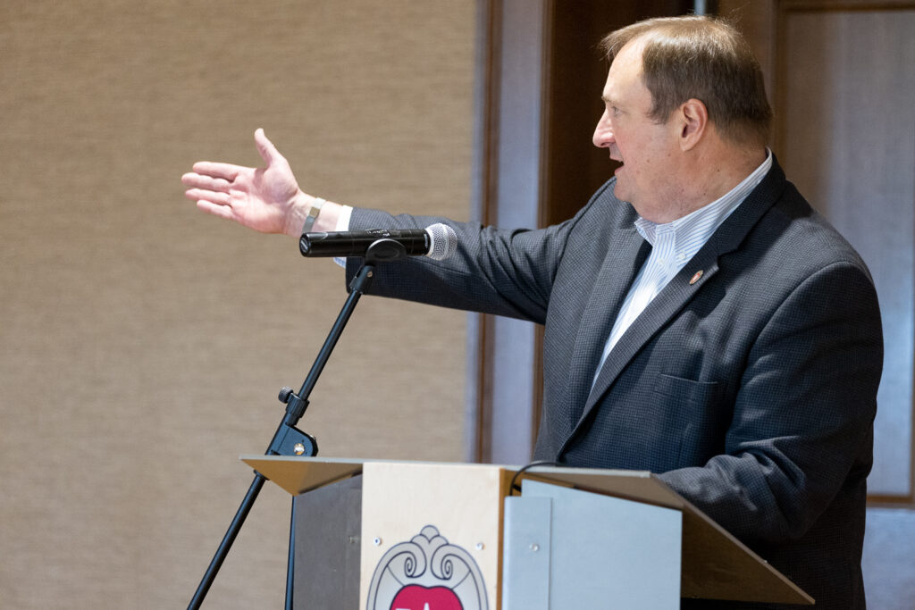 Dean Steve Swanson speaks at the podium.