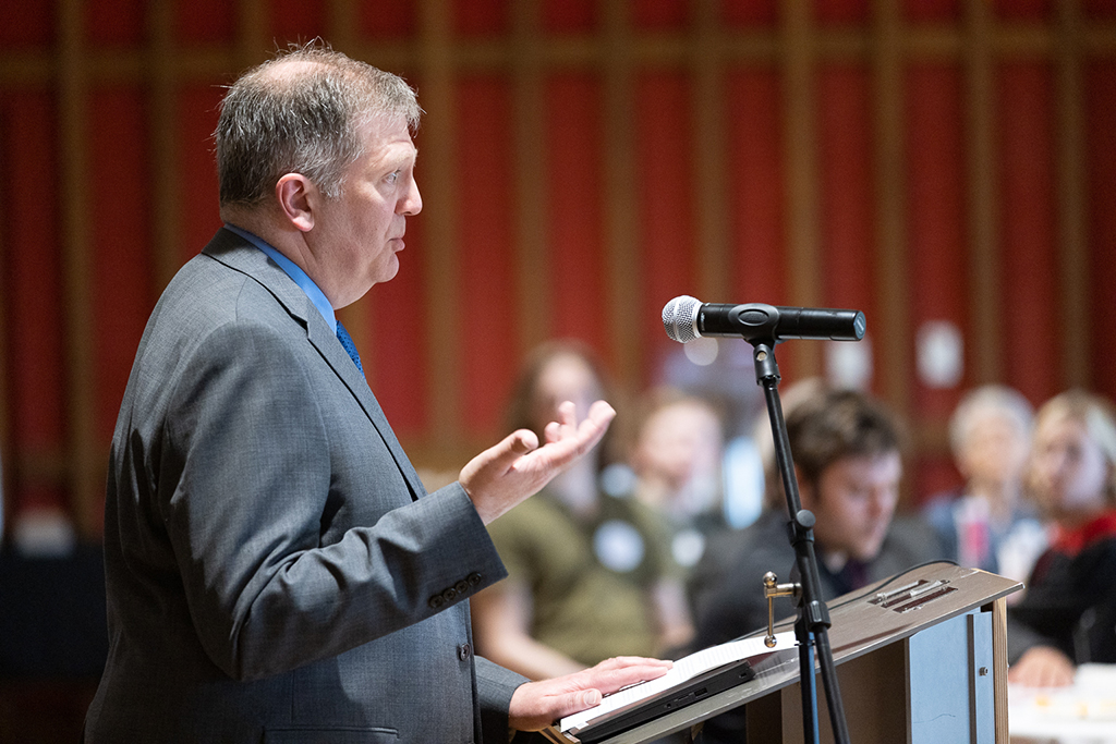 Pat Dowling speaks at a podium