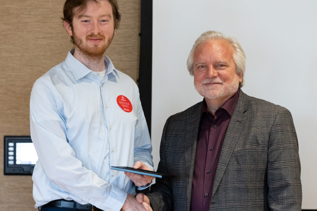 Jeff Johnson and a PharmTox graduate pose for a photo.