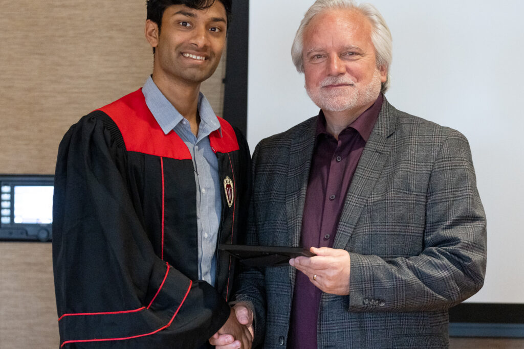 Jeff Johnson and a PharmTox graduate pose for a photo.