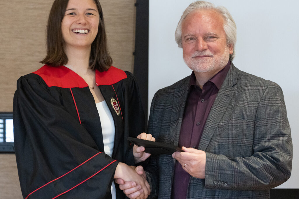 Jeff Johnson and a PharmTox graduate pose for a photo.